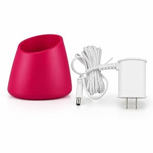 Conair pink facial brush charging dock stand with white wall power adapter cord