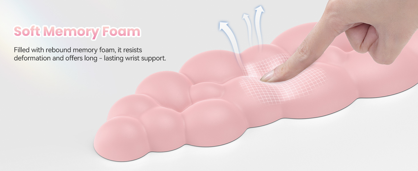 Pink memory foam insole with cloud-like texture. Hand demonstrating its softness by pressing into the foam, which rebounds. Text indicates it provides deformation and stress relief.