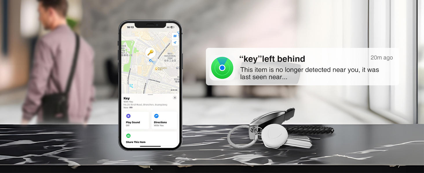 Desktop workspace scene showing mobile devices, laptop, and other electronics on a light surface with natural lighting.