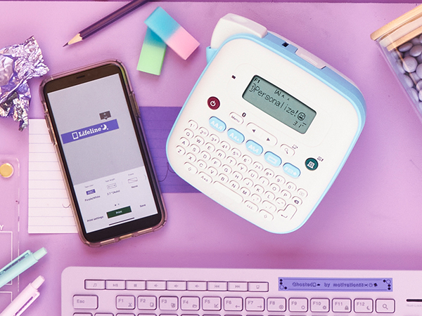 PT-N25BT labeler with purple labels with white or black text on calendar, keyboard with inspiration