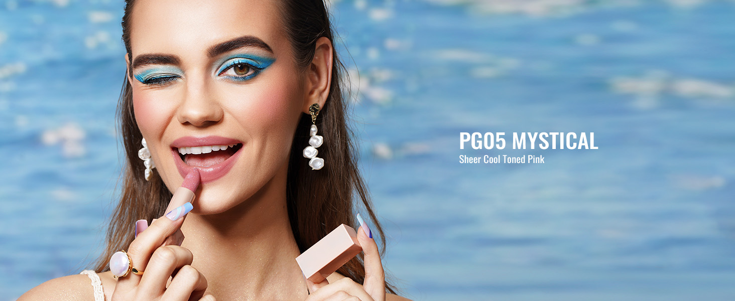 a model with a makeup brush and a makeup brush
