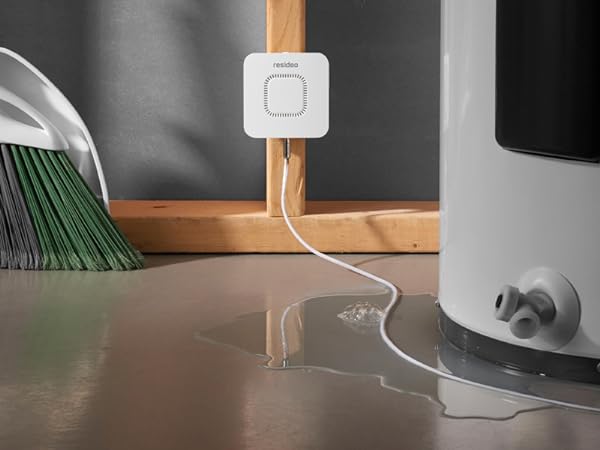 RWD42 Water Leak Detector mounted on wall next to leaking water heater