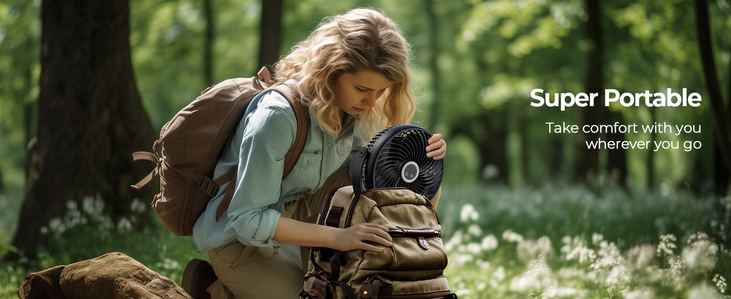 Compact black device held by person in outdoor setting. Text 'Super Portable' visible, suggesting a portable product for outdoor use.