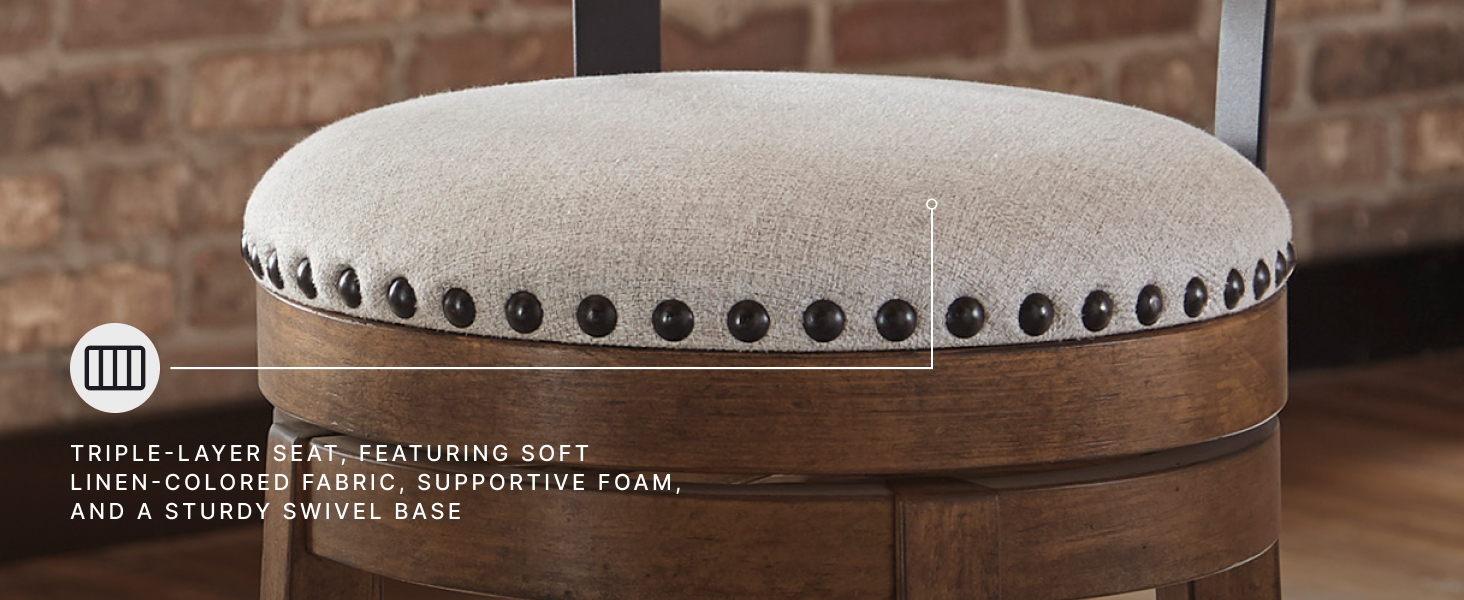 Detailed view kitchen stool displaying nailhead trim on linen colored polyester cushion