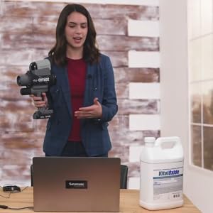 Woman Standing and Presenting to an On-Line Class at a Distance from the Laptop