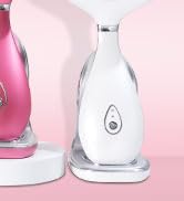 Two glass water bottles with different shapes. One tall and slim, one shorter and wider. Pink background. Minimalist product display setup.