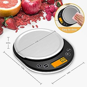 Digital kitchen scale with circular stainless steel platform and LCD display. Shows weight in grams. Inset image demonstrates easy cleaning feature.