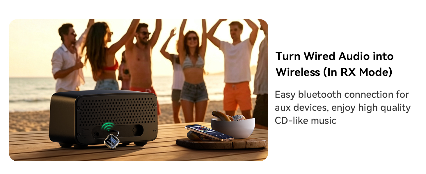 Text reads: 'Turn Wired Audio into Wireless (In RX Mode)' and 'Easy bluetooth connection for aux devices, enjoy high quality CD-like music.' Black portable Bluetooth speaker on beach with people dancing, displaying wireless audio capability for outdoor entertainment.