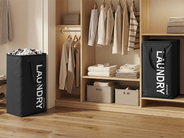 Text reads 'LAUNDRY'. Storage area showing multiple dark storage boxes or containers arranged on wooden shelving unit with clothing items visible.