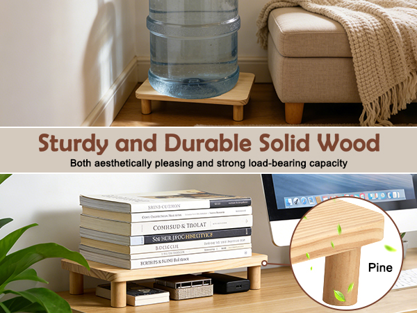 Text reads 'Sturdy and Durable Solid Wood'. Wooden monitor stand or riser shown with water bottle on top, demonstrating its strength.