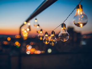 Heavy duty weatherproof outdoor dimmer automatically managing late night porch string lights