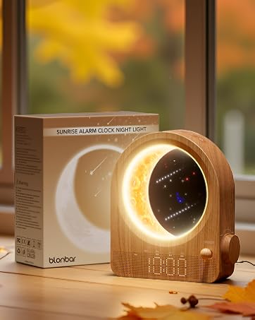 Cozy autumn scene with window display featuring pumpkins, twinkling lights, and product placement against orange fall foliage background.