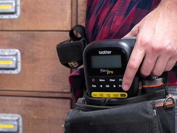 Person holding PTH111 P-touch Pro Label Maker in tool belt