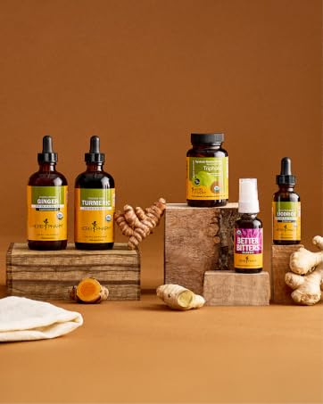 Herb Pharm&amp;amp;#39;s digestion supplements on a rusty orange background with ginger and turmeric.