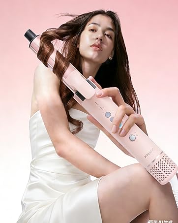 Product demonstration showing handheld electronic device with pink and white coloring being used.