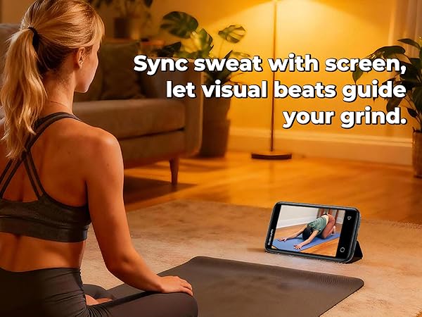 Woman doing a home workout while following an exercise video on an MP3 player screen.