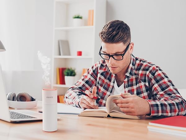 white air purifier on desk