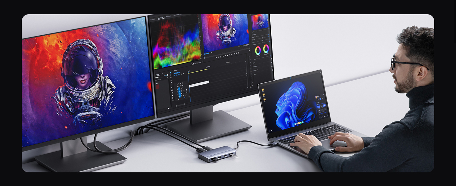 Multiple laptops displaying colorful screen content arranged in different positions and angles.
