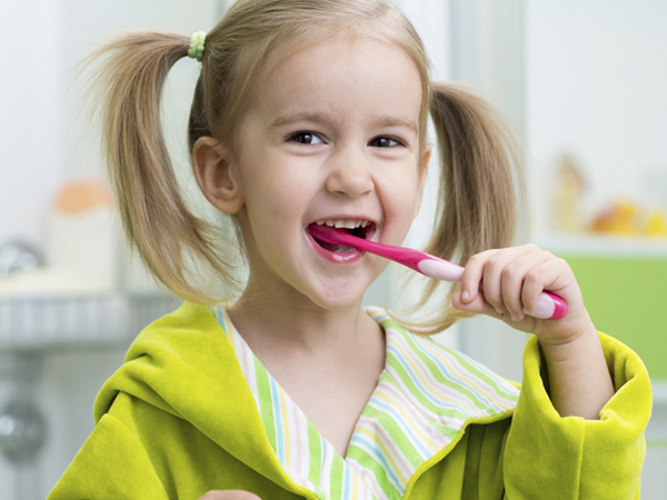 kid brushing teeth