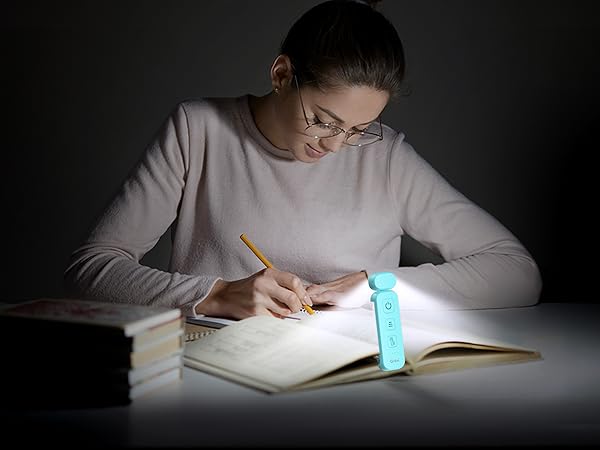 a student writing on a book
