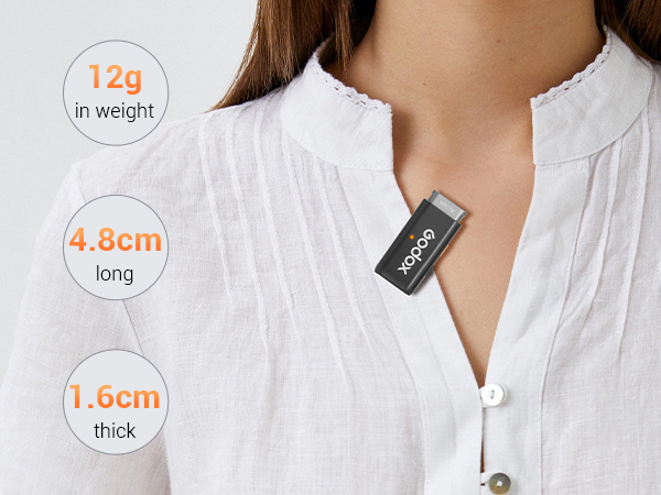 Close-up of person wearing white collared shirt with small rectangular device pinned to it. Device specifications: 12g weight, 4.8cm long, 1.6cm thick.