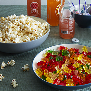 Popcorn and gummy bears in Colorwave Blue and Slate grey dinnerware.
