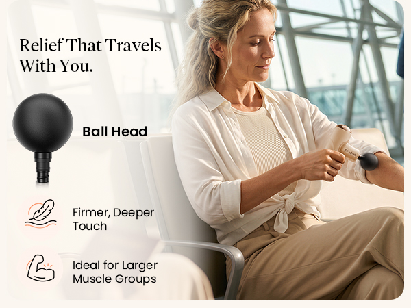 Woman uses the ball head on her forearm while seated with luggage at an airport.