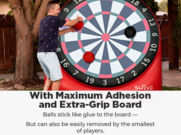 Swooc games for people that do it big. Boy about to kick kickballs at giant dartboard.