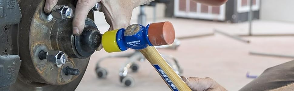Using a soft face mallet to drive an axle cap in