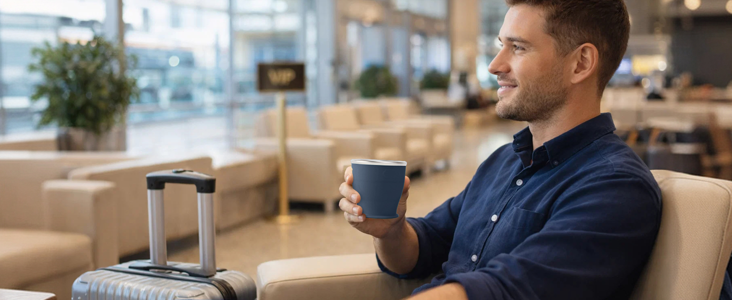 Drinking water with SINYON collapsible cup at the airport