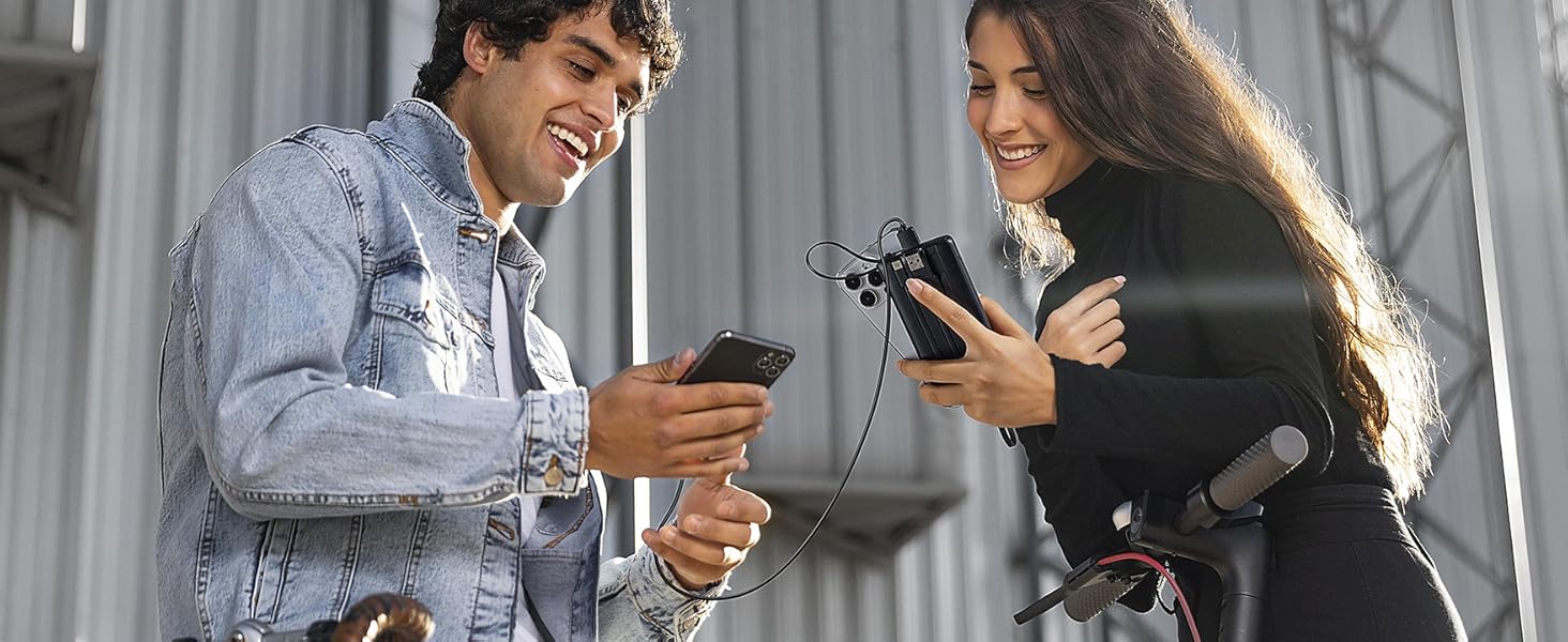 a man and woman are using their phones.