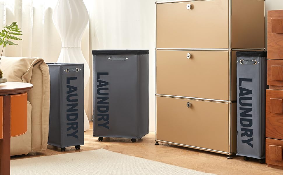 Storage system with multiple brown cardboard boxes and black labeled units arranged against a wall, with decorative plants nearby.
