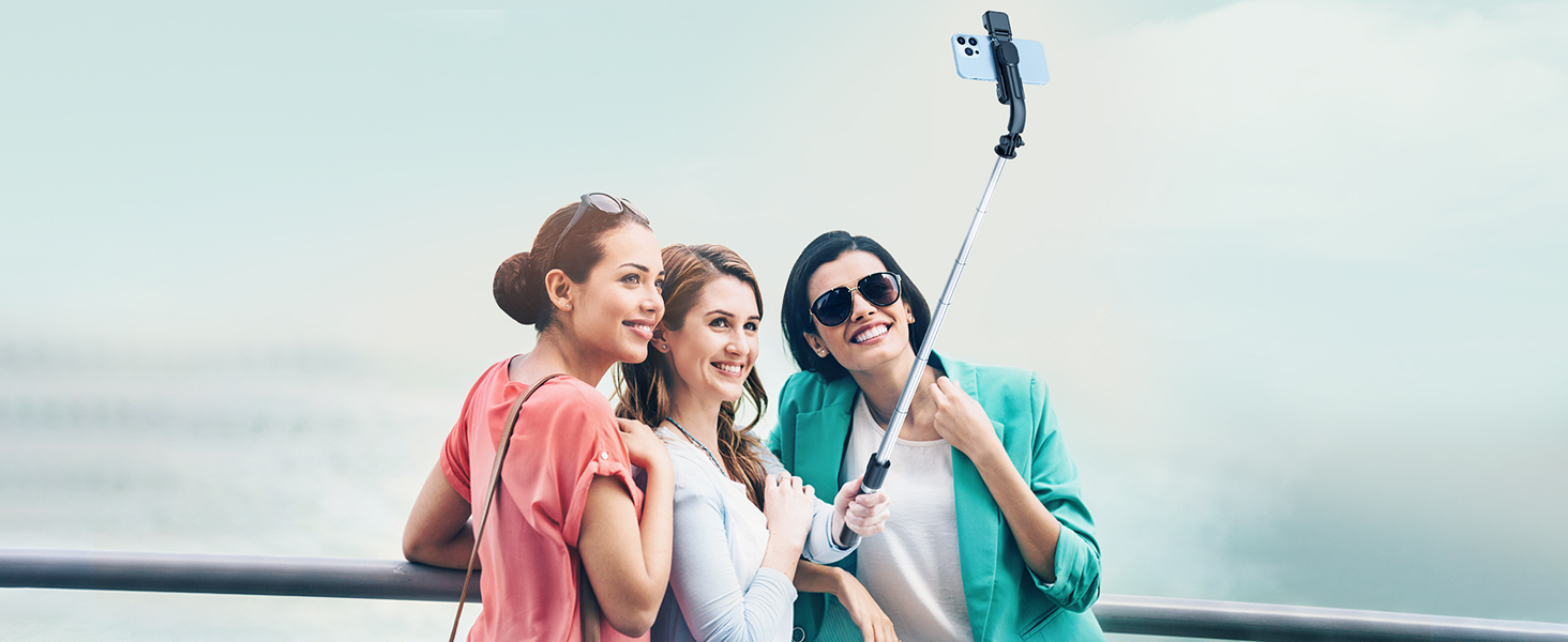 three women taking a selfie with a cell phone