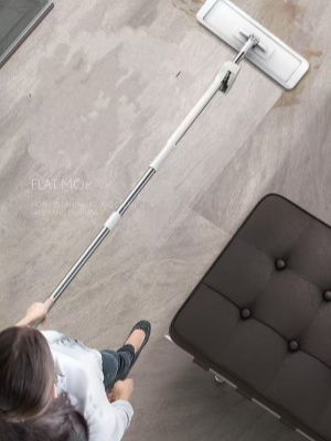 360° rotating flat mop being used to clean a hard floor