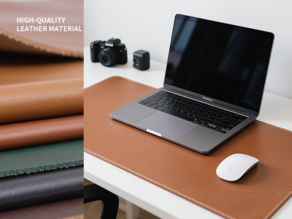 brown leather desk pad on the desk, computer pad on the desk