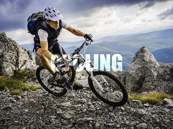 Mountain biker riding on rocky terrain, wearing helmet and backpack. Text overlay reads 'CYCLING' against dramatic sky and mountain backdrop.