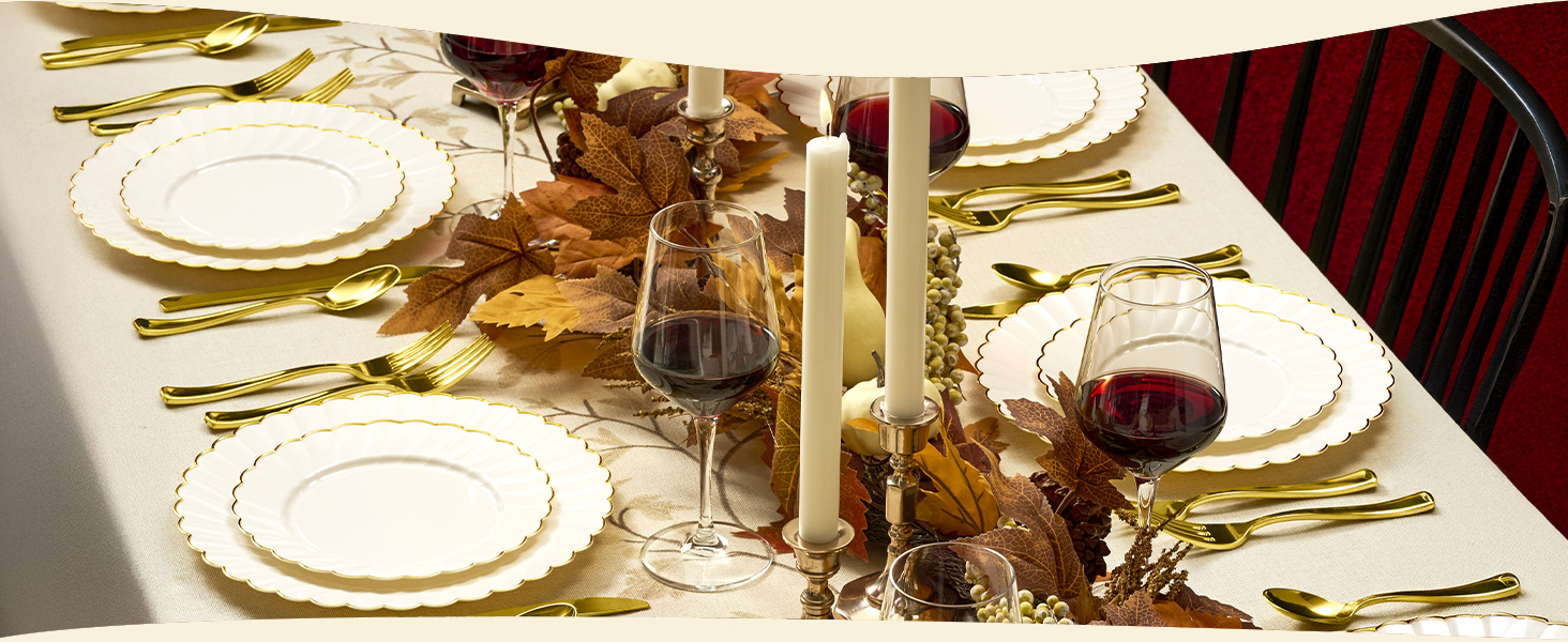 Ivory Scalloped Plastic Plates with Gold Trim on a fall table with red wine glasses and candles