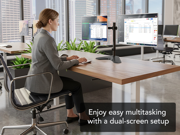 Office scene with dual monitors on a pole mount for easy multitasking.