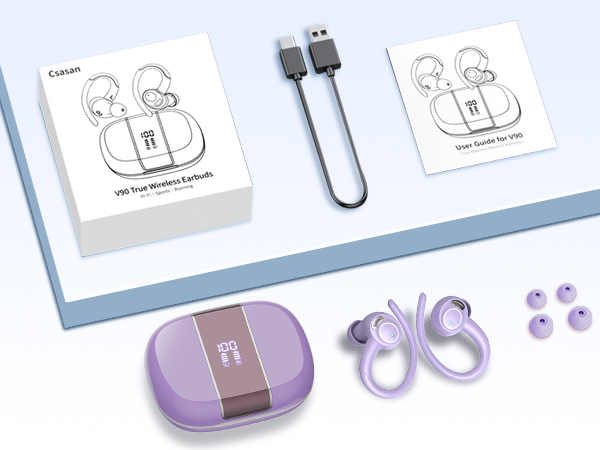 Wireless earbuds set with purple charging case, USB cable, instruction manuals, and decorative purple accessories displayed on light blue surface