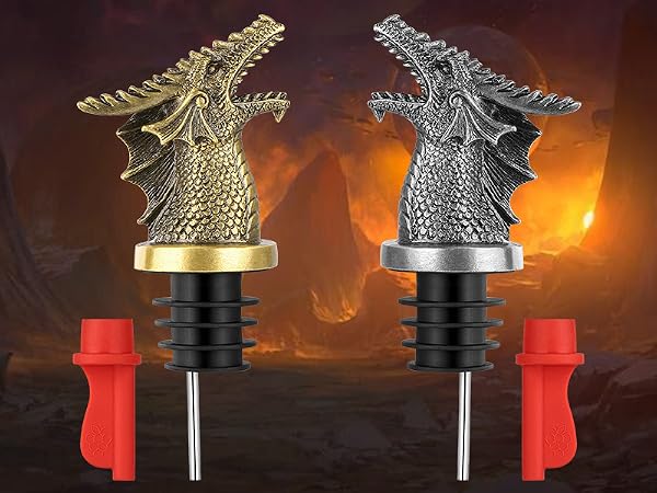 Two decorative dragon-shaped figures in gold and silver finishes, mounted on red bases with black stems against a fiery background.