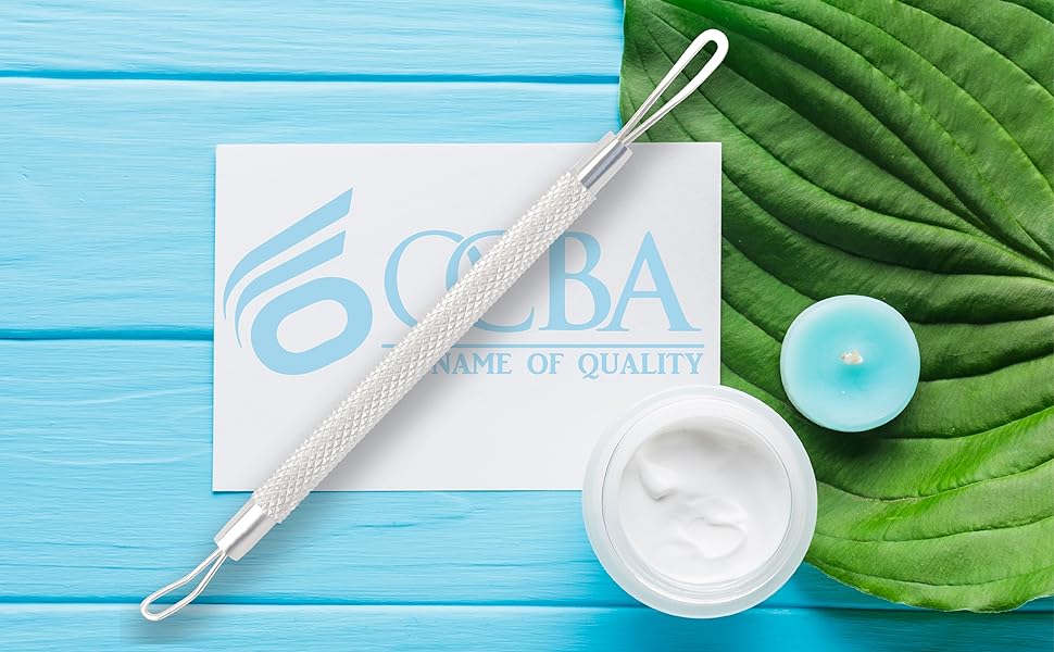 a white and blue table with a blue background and a white cream and a jar of cream