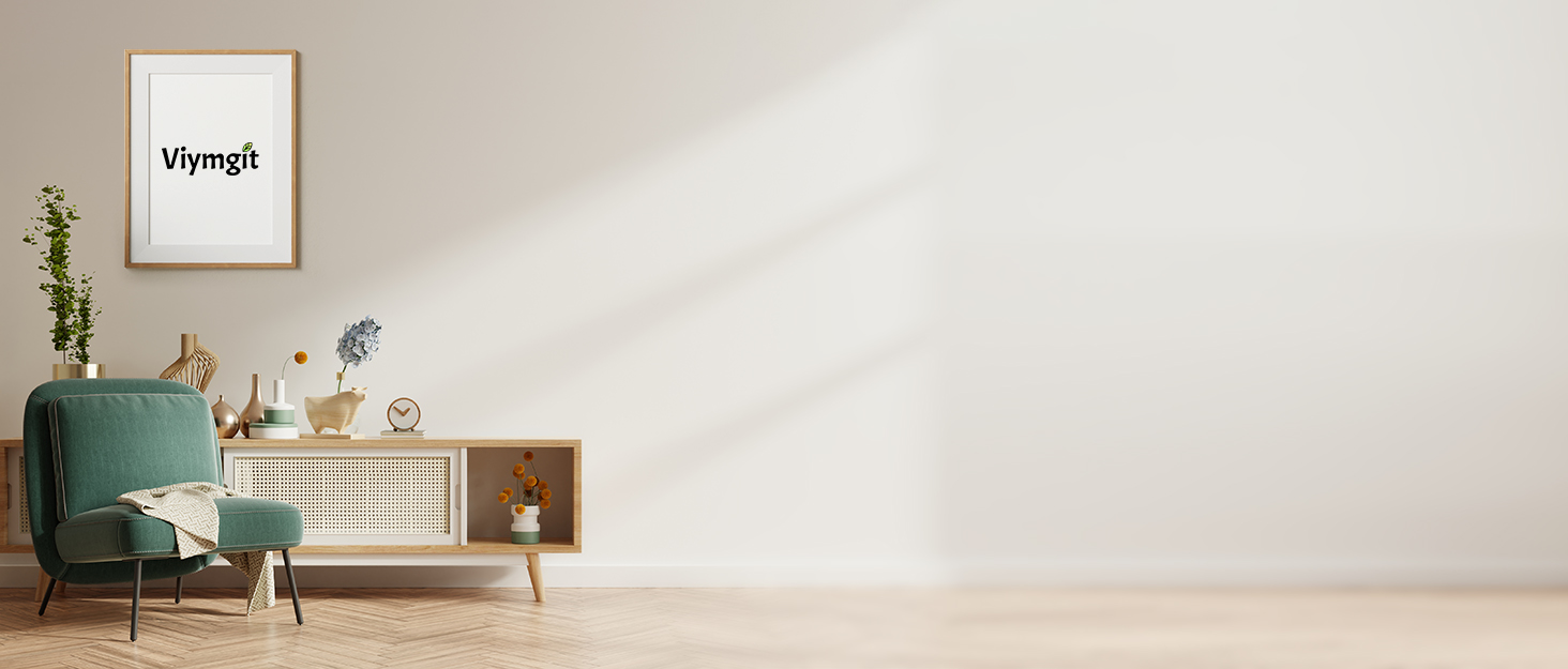Minimalist living room interior with green accent chair, white walls, wooden sideboard, and decorative frame.