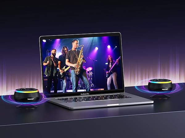 Stage performance setup with multiple LED screens and lighting displays. Series of connected screens showing blue and purple lighting effects in a dark venue.