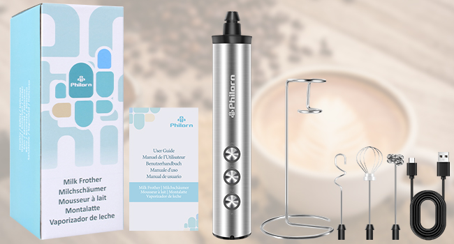 Sleek silver vaporizer pen with accessories including charger and refill pods. Blue packaging visible in background.