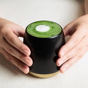 holding iced matcha tea