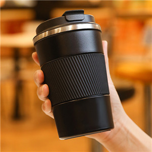 thermos cup is made of stainless steel and has a reusable lid.