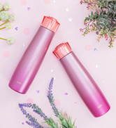 Two 20 oz stainless steel water bottles with pink ombre and gem lid with flowers