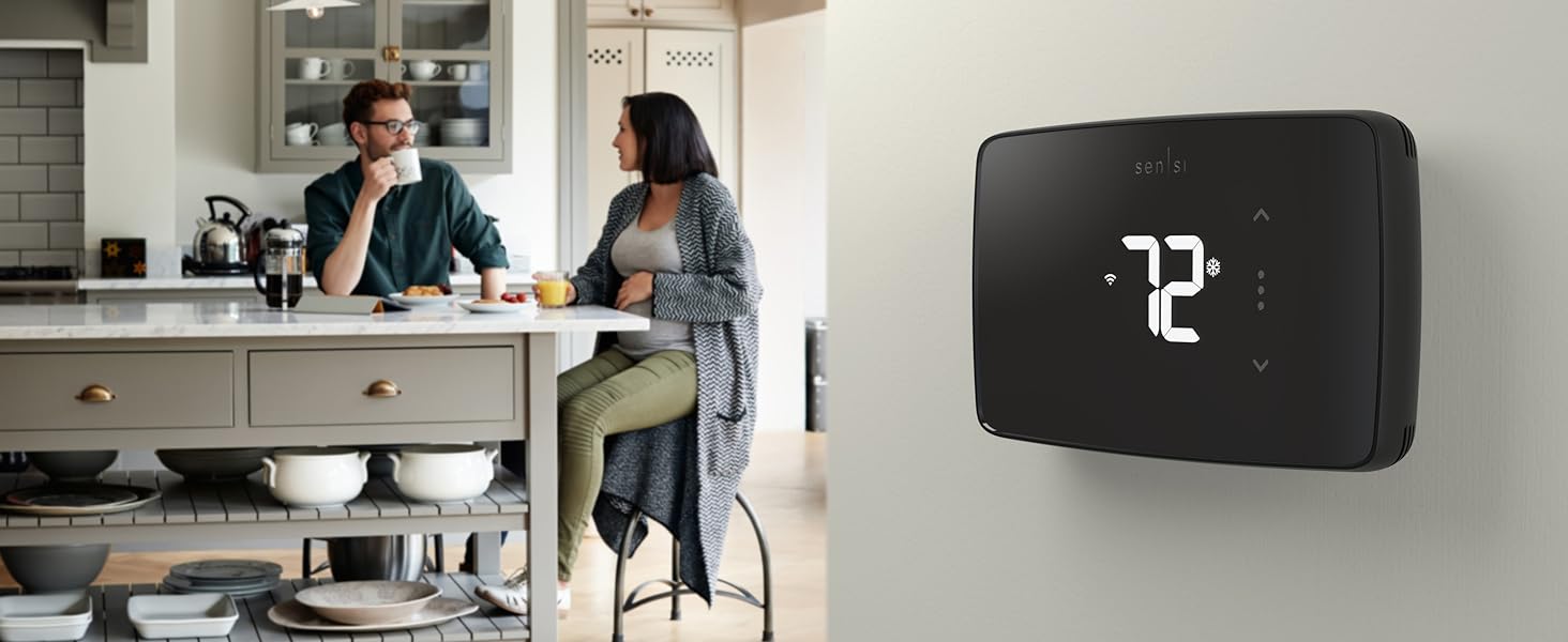 Sensi Lite on wall with couple in a kitchen in background