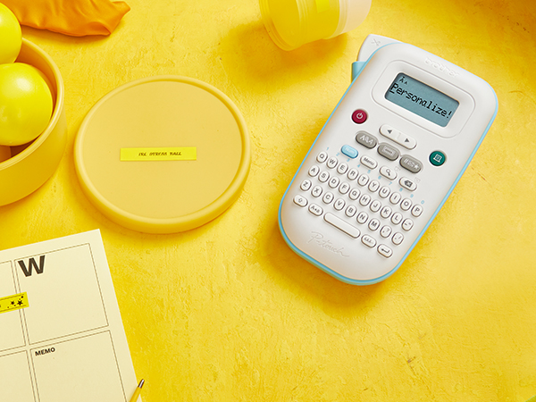 Black on yellow labels from PTN10: lid with "IRL Stress Ball" and calendar with "Playdate With Max"