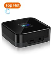 Small black square device with rounded corners, possibly a streaming or media player. Features a glowing blue light on the front.